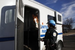 Park Police Horse Mounted Patrol Unit Officer Baum, who is working without pay due to the government shutdown, puts Monty into a horse trailer at the end of their day, across from the Martin Luther King Jr. Memorial, Thursday, Dec. 27, 2018, in Washington, during a partial government shutdown. President Donald Trump has vowed to hold the line on his budget demand, telling reporters during his visit to Iraq Wednesday that he'll do "whatever it takes" to get money for border security. The White House and congressional Democrats have been talking but to little effect. Washington area national parks will remain open during the partial government shutdown, but without visitor center services. (AP Photo/Jacquelyn Martin)