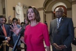 Speaker of the House Nancy Pelosi, D-Calif., center, joined at right by Majority Whip James Clyburn, D-S.C., pushes back on President Donald Trump's demand to fund a wall on the US-Mexico border with the partial government shutdown in its second week, at the Capitol in Washington, Thursday, Jan. 3, 2019. (AP Photo/J. Scott Applewhite)