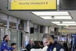 Passengers stand in line as they wait to pass through a Transportation Security Administration checkpoint at LaGuardia airport Monday, Jan. 7, 2019, in New York. (AP Photo/Frank Franklin II)