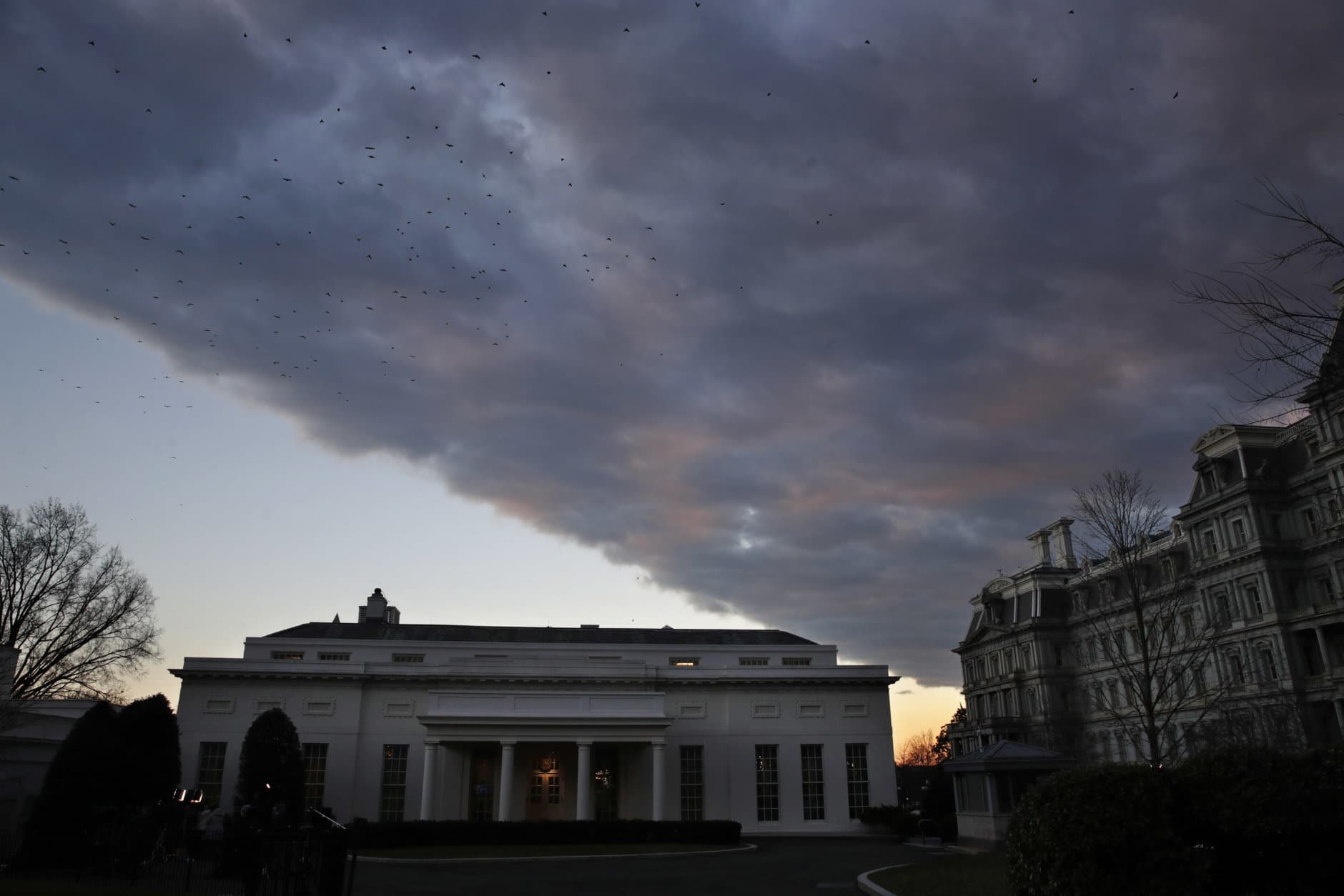 A cloud passes over the West Wing of the White House at sunset, Tuesday Jan. 8, 2019, a few hours before President Donald Trump is scheduled to make an address to the nation in Washington. (AP Photo/Jacquelyn Martin)