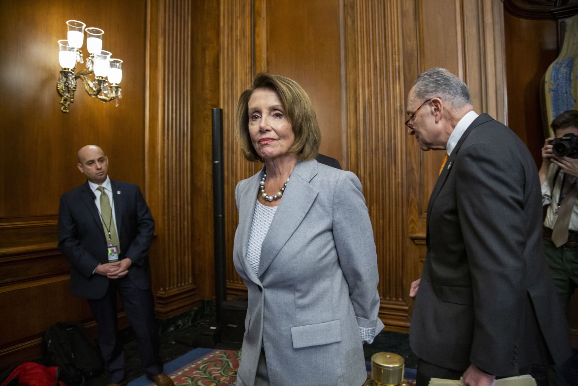 Speaker of the House Nancy Pelosi, D-Calif., and Senate Minority Leader Chuck Schumer, D-N.Y., right, leave an event with furloughed federal workers amid the partial government shutdown, on Capitol Hill in Washington, Wednesday, Jan. 9, 2019. Top Democrats say President Donald Trump walked out of a meeting with congressional leaders as talks to end the shutdown remain at an impasse. (AP Photo/J. Scott Applewhite)
