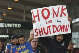 More than two dozen federal employees and supporters demonstrate at the Sacramento International Airport calling for President Donald Trump and Washington lawmakers to end then partial government shutdown, Wednesday, Jan. 16, 2019, in Sacramento, Calif. (AP Photo/Rich Pedroncelli)