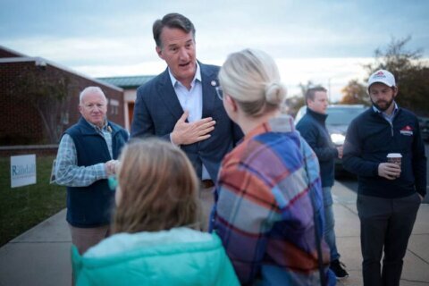 Virginia Gov. Glenn Youngkin greets voters