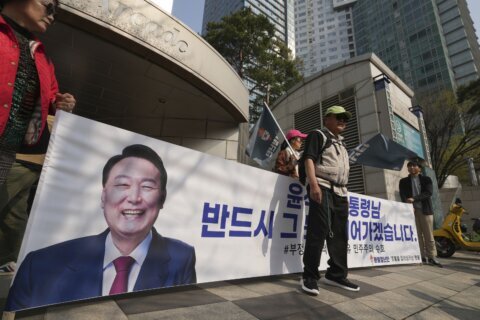 Ousted South Korean President Yoon embraces supporters after leaving presidential residence